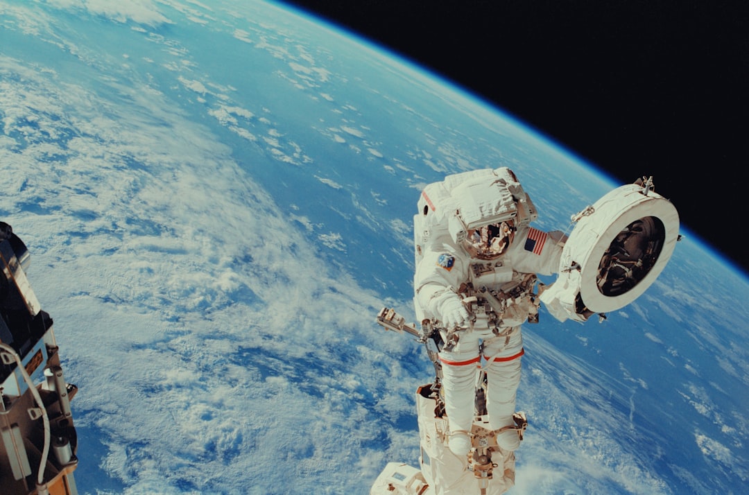 Astronaut Franklin R. Chang-Diaz works with a grapple fixture during extravehicular activity to perform work on the International Space Station